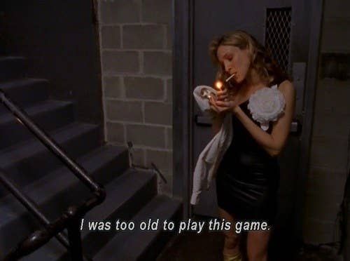 Screengrab of Carrie from "Sex and the City" smoking a cigarette with overlay text saying, "I was too old to play this game."